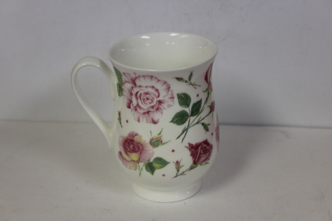 A Roy Kirkham Mug: 4 1/4" tall