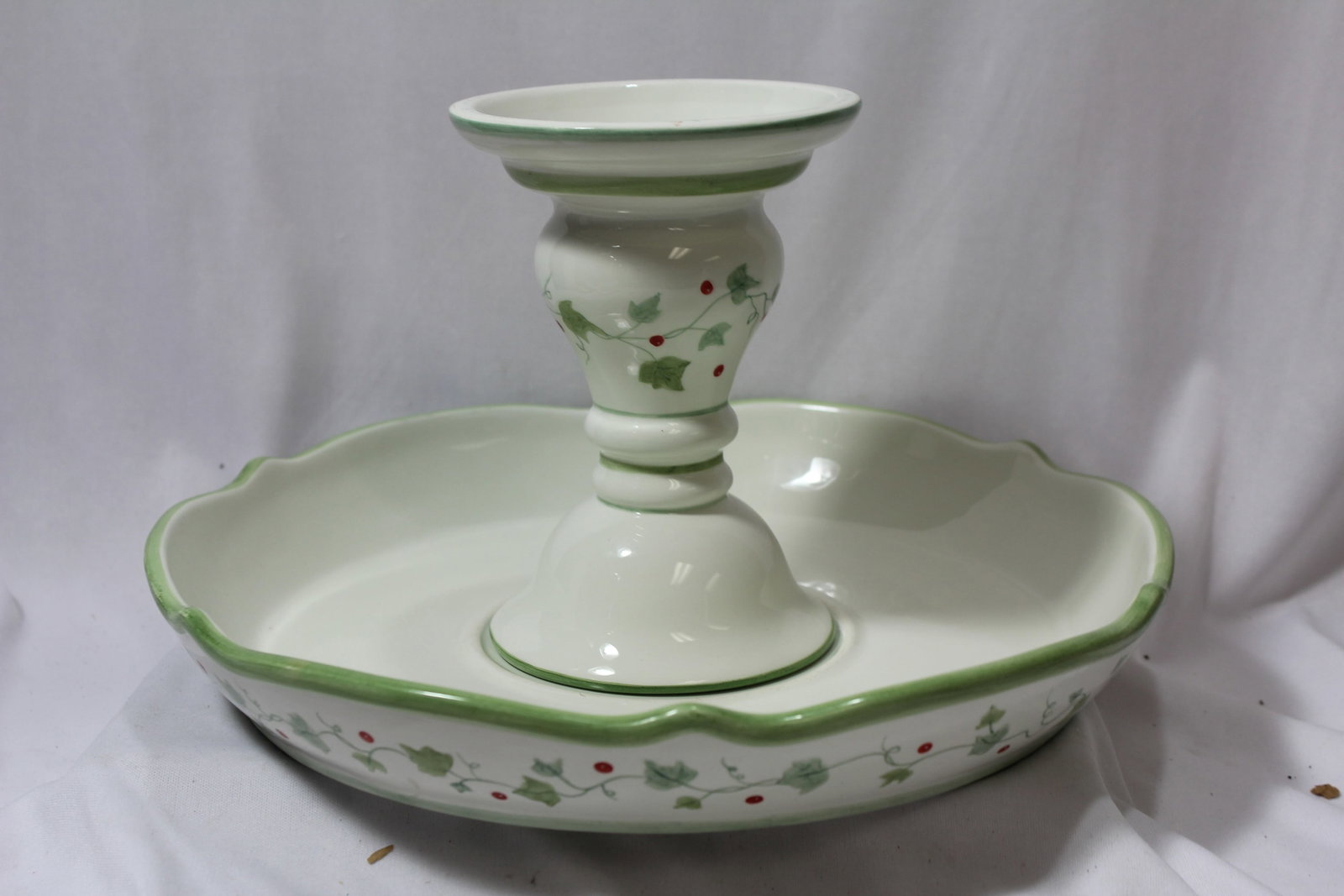 A Ceramic Candle Holder and Tray: undertray= 6 1/4" in diameter