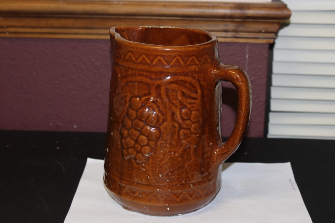 An Antique Majolica Brown Pitcher Pitting: 8 inches tall - rim worn - most likely