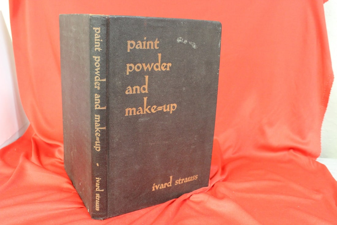 A Hardcover Book: Paint, Powder and Makeup: as shown