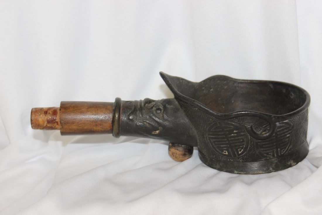 An Antique Chinese Bronze Iron: most likely from the 19th century - 9 inches long`