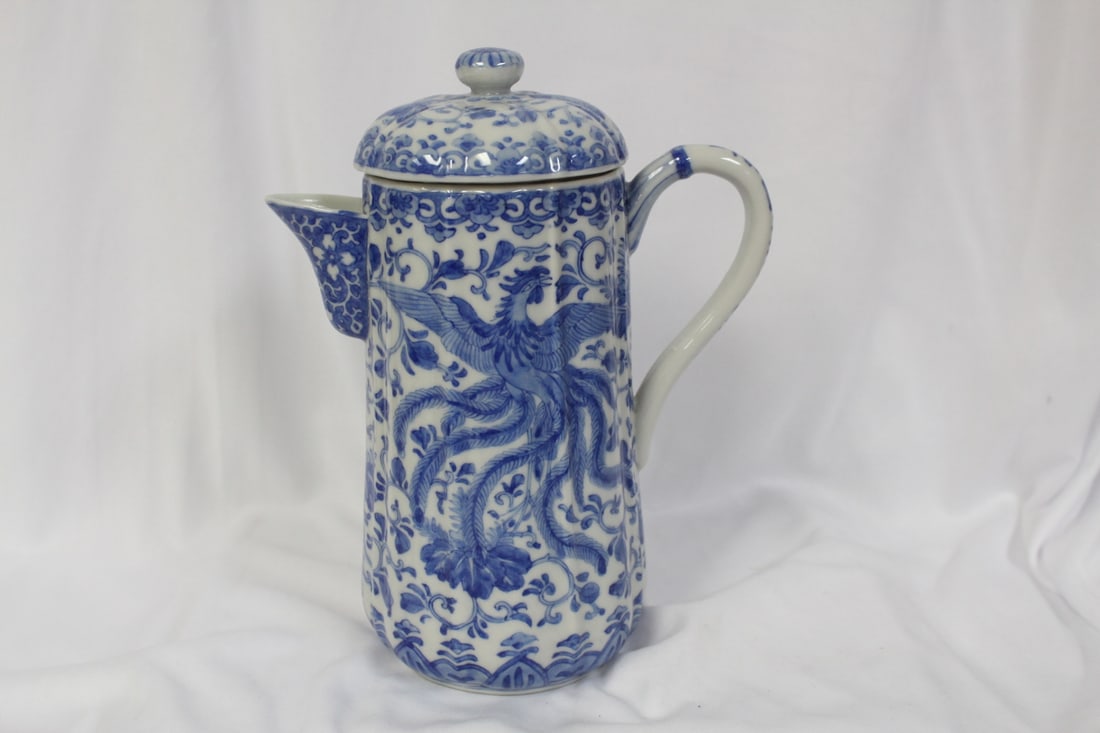 A Chinese Blue and White Teapot: please note: chip underlid, not noticeable when lidded - 8 1/2" tall