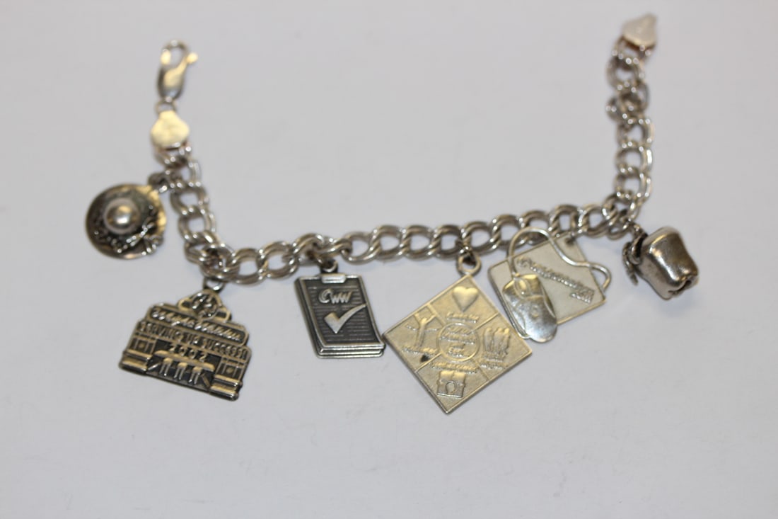 A Sterling Charm Bracelet: 6 1/4" long unclapsed