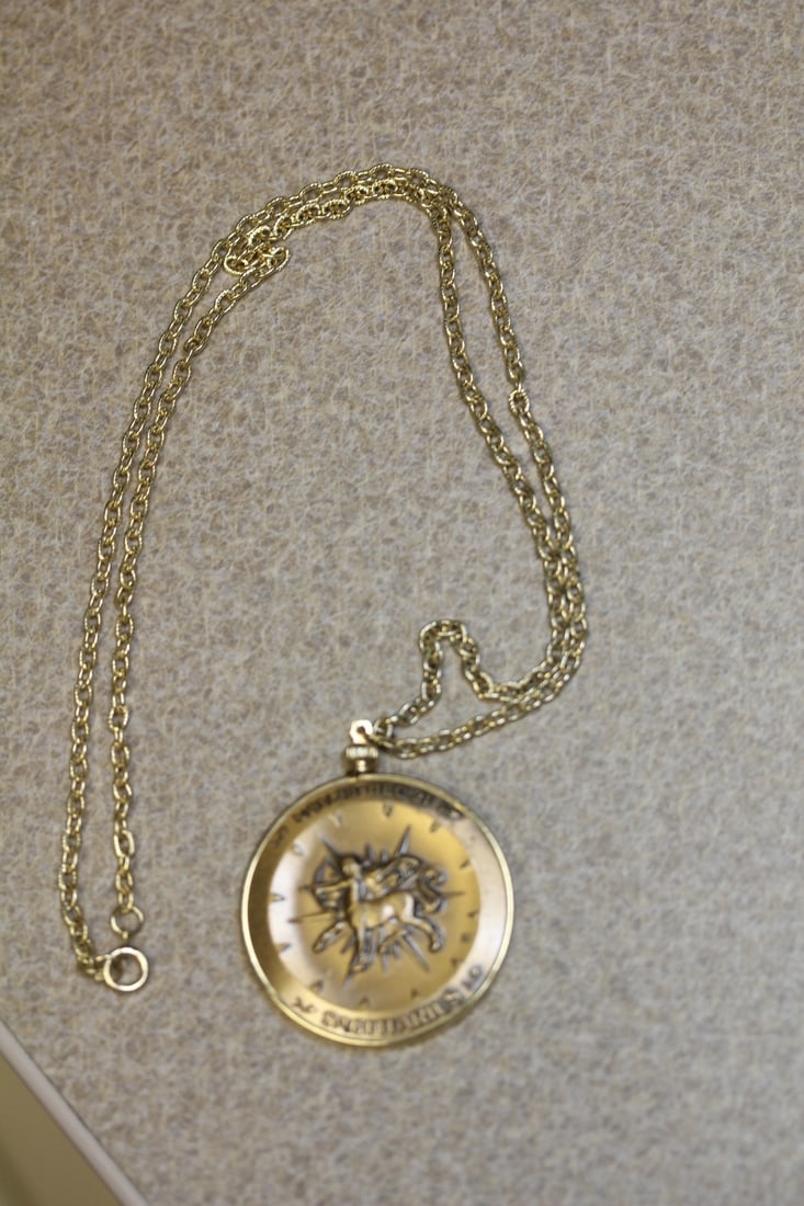 Medal pendant: bronze, with metal chain, overall 13 3/4" in length when clapsed