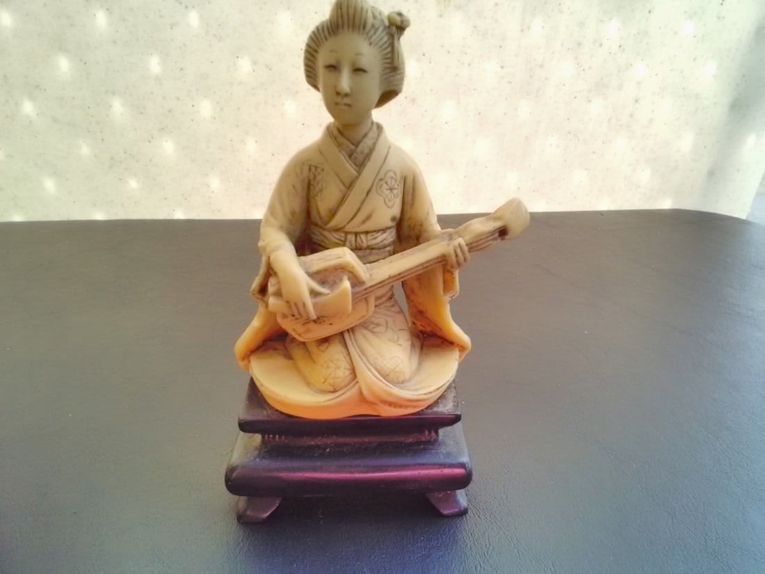 A Japanese Mid Century Resin Musician Figurine (1 of 5)