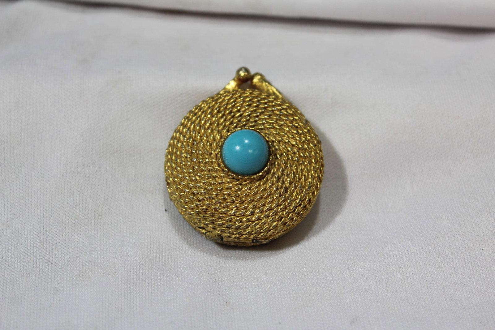 A Metal Trinket Box: 1 1/2" in diameter