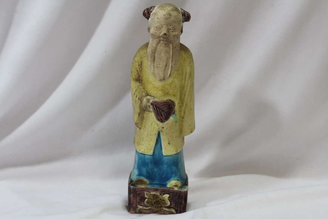 An Antique Chinese Figurine: 8 3/8" tall