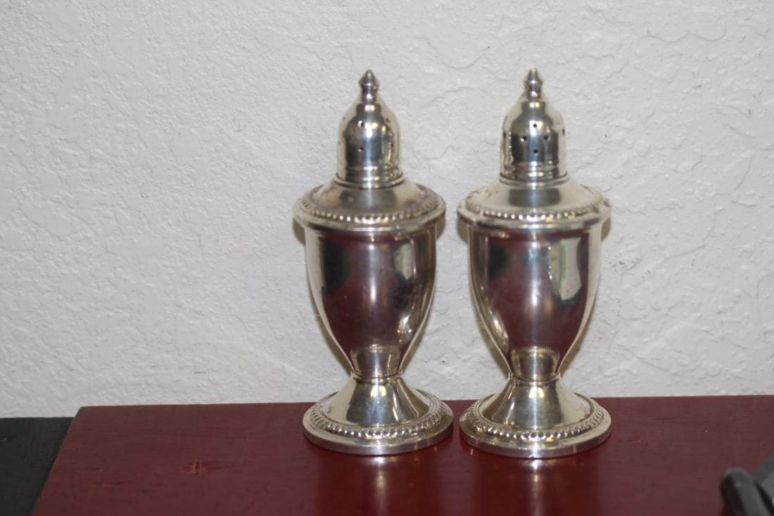 Pair of Sterling Salt and Pepper Shakers: weighted - 4 1/2" tall each