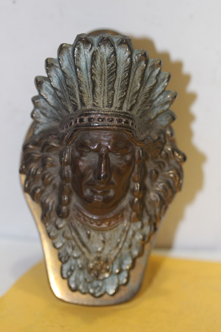 A Bronze Indian Clip: mostly by Judd - 4 1/2" long