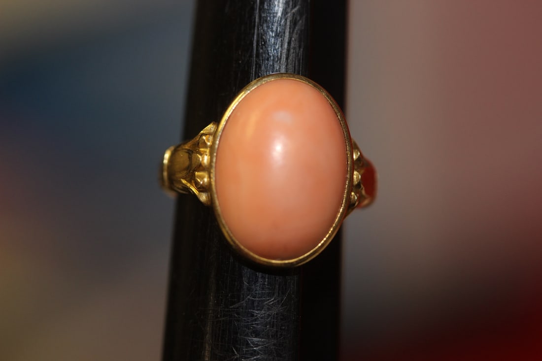 An Angel Skin Coral and 14Karat Gold Ring: Marked 14Karat on the shank