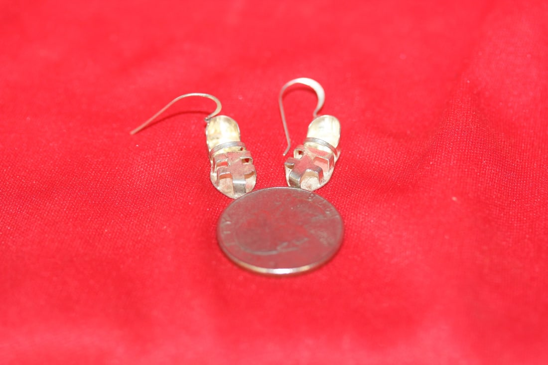 A Pair of Sterling Earrings: as shown