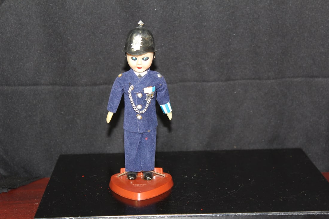 A Sleepy Eye Carlson Doll: "Police" - 6 3/8" tall
