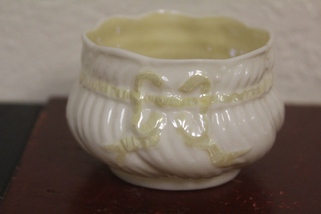 A Belleek Ribbon Bowl: 3 inches in diameter