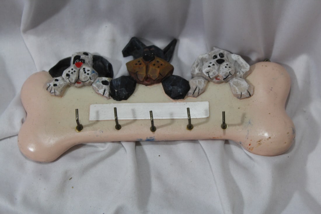 A Dog and Bone Wall Hanger: 8 1/4" across