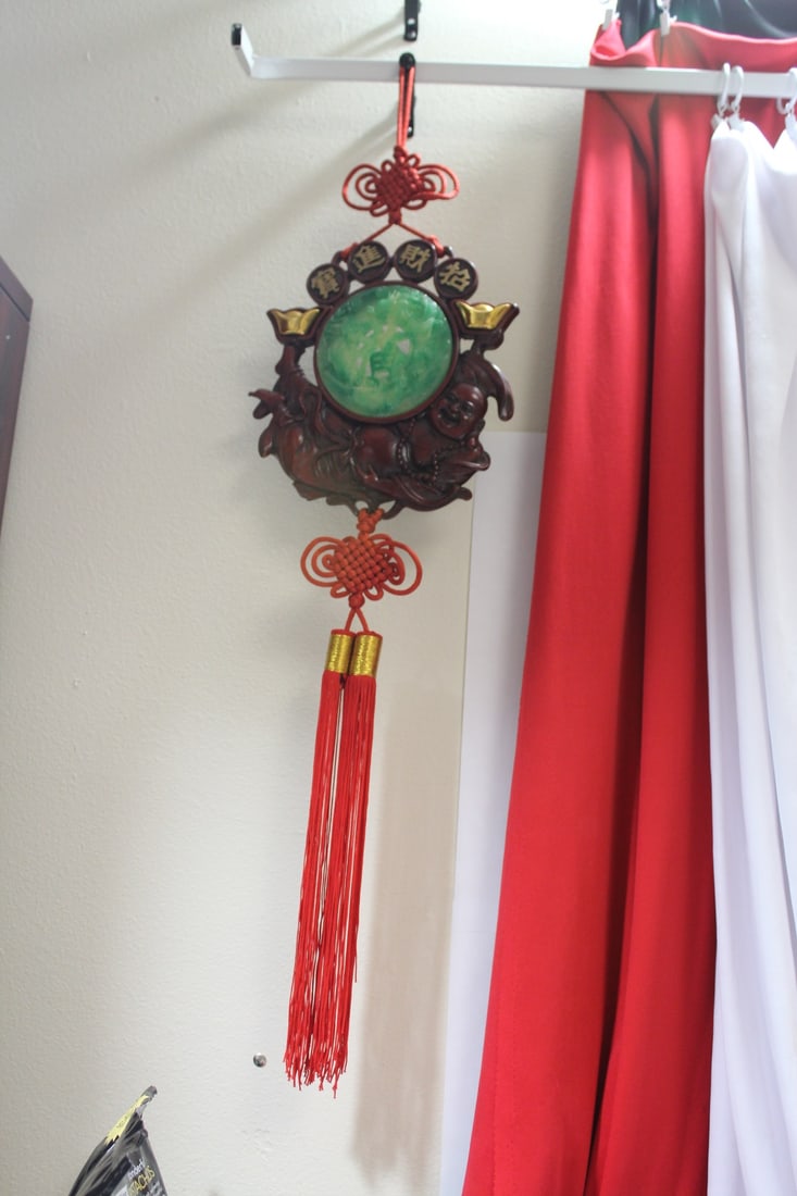 A Carved Chinese Resin Ornament: overall= 34 1/2" tall
