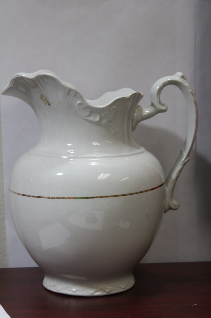An Antique Ceramic Pitcher: please note: bottom chip and small hairline as shown - 11 1/4" tall