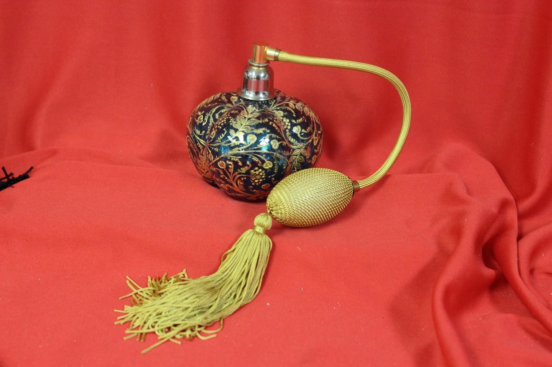 A Beautiful Teal Glass Gold Overlay Parfume Bottle: with atomizer - 4" tall
