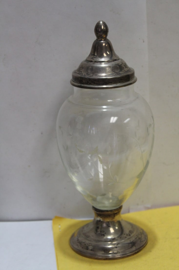A Sterling Base Cut Glass Container: base is weighted - with lid - please note: one part of the bottom rim is slightly bumped - makers mark= watrous - 9 1/2" tall