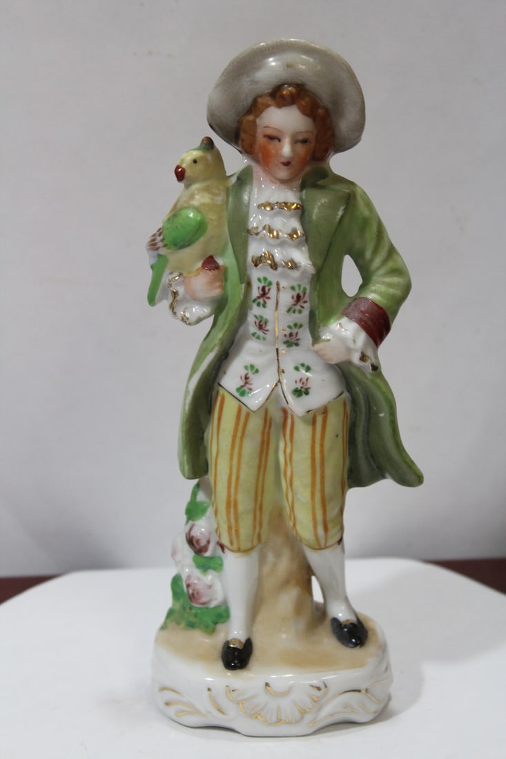 A Japanese Ceramic Figurine: 8 1/4" tall