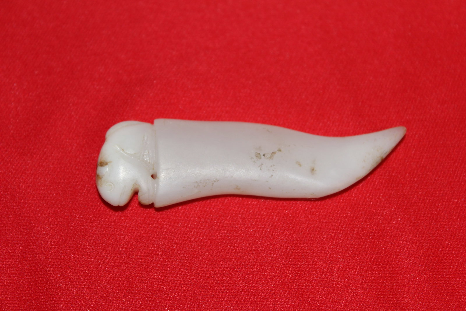 Carved White Jade Pendant in Knife Form: 2 5/8" long.