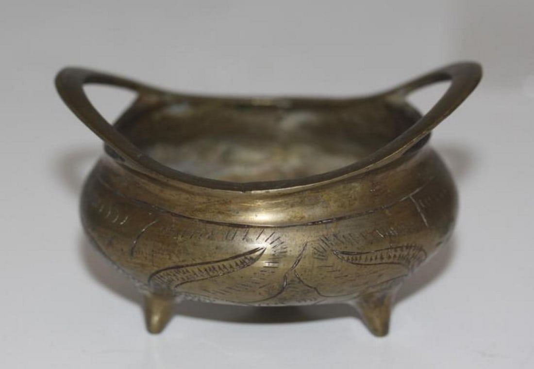 Antique Chinese Censor 19th / 20th Century: Probably bronze. Signed on the bottom. 1 3/4" tall (not including handle) x 4" at widest point.