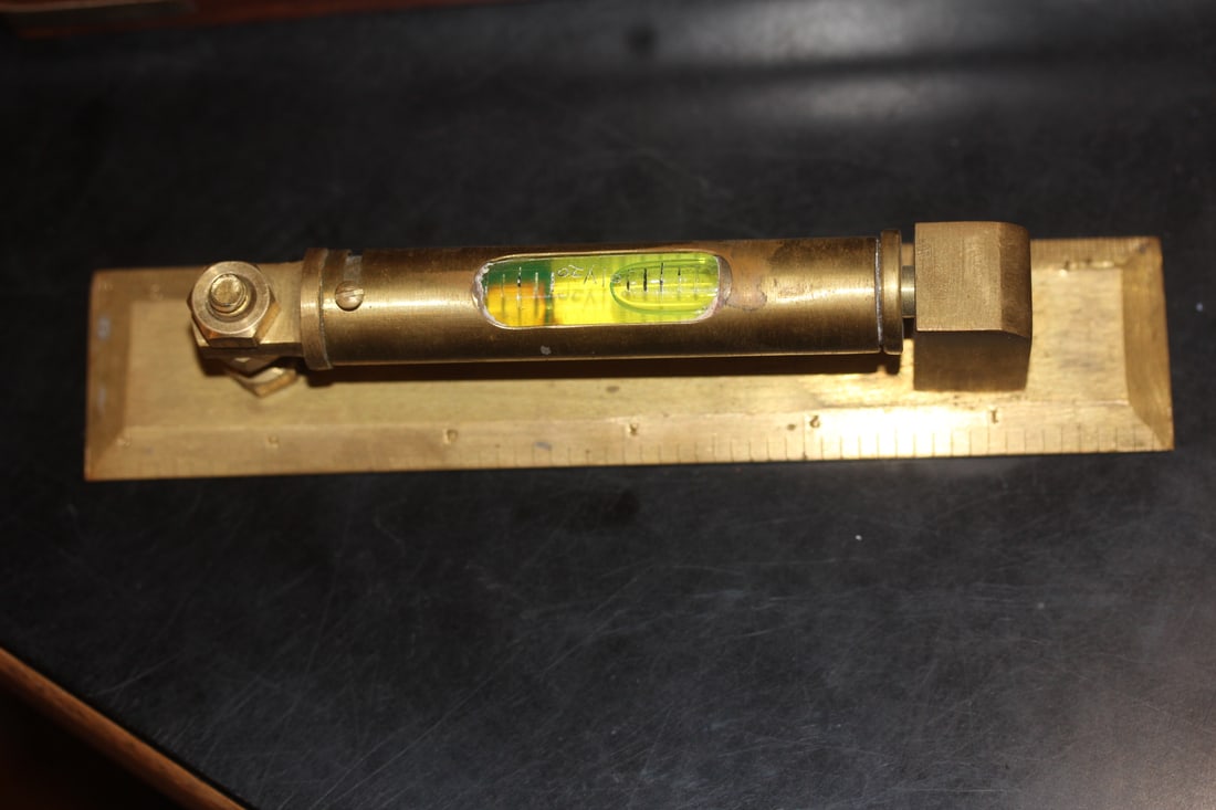 Vintage Brass Level: inside an exotic wood custom case - most likely Rabone and Son - overall= 7 inches across