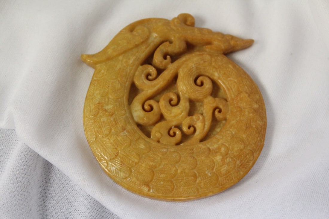 A Carved Jade or Stone Plaque: 3 1/8" in diameter