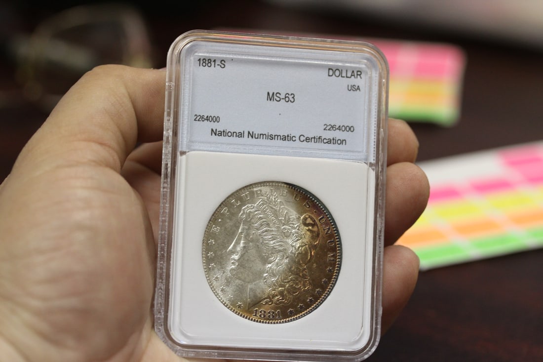An NNC Graded 1881-S Morgan Silver Dollar: MS63 - crescent tone