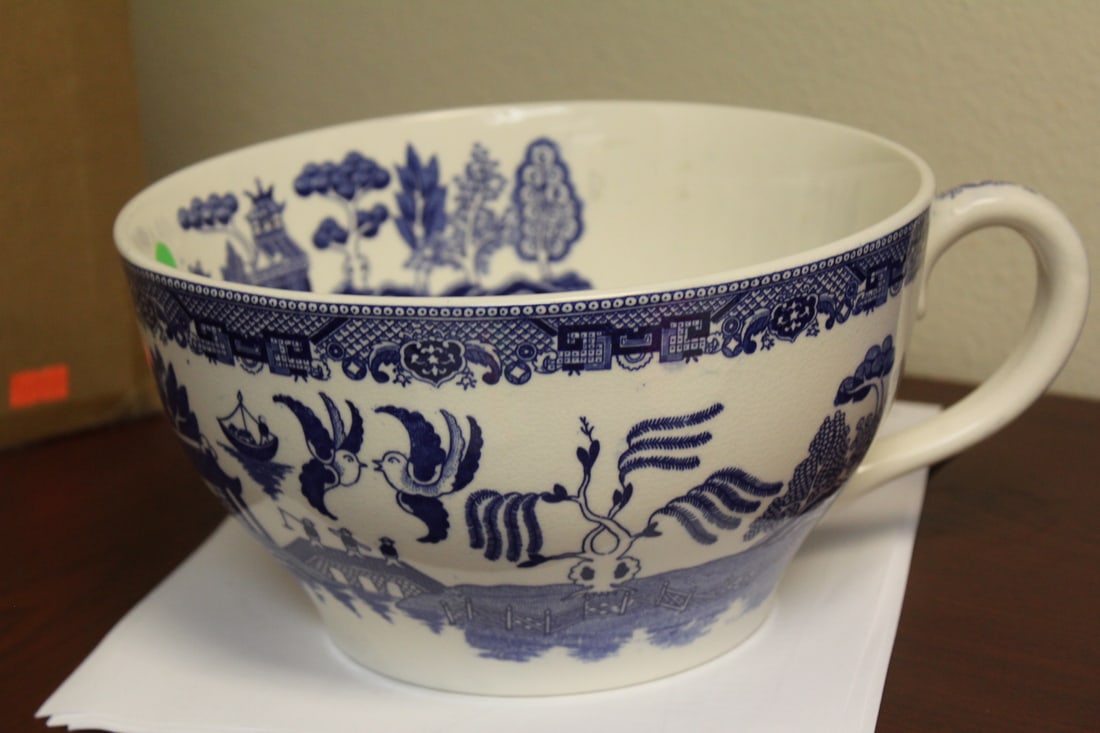 A Large Vintage Japanese Cup: blue and white willow motif -8 3/4" in diameter not including tha handle