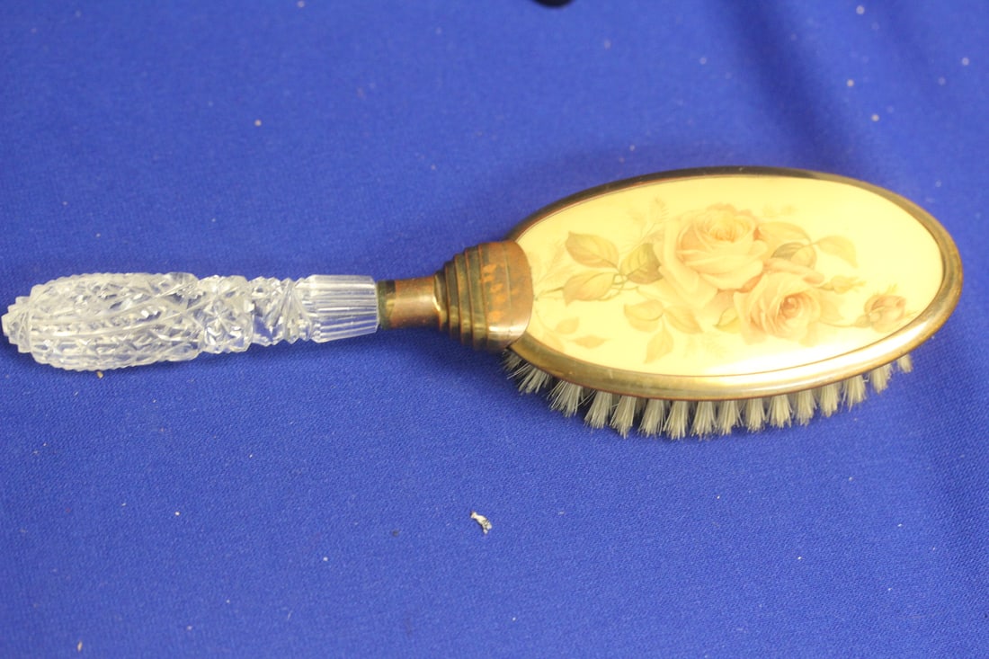 A Celluloid Brush: 9 1/8" across