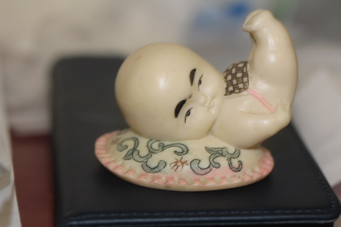 Signed Chinese Resin Boy: 2 inches across