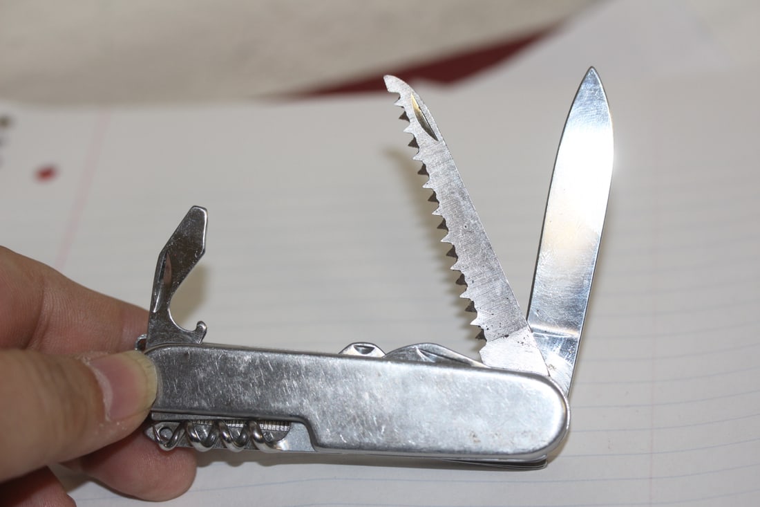 A Utility Knife: 3 1/2" long