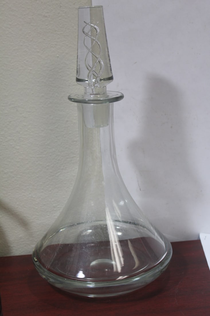A Clear Glass Decanter: appears to be well made - can use a little cleaning - 13 1/8" tall