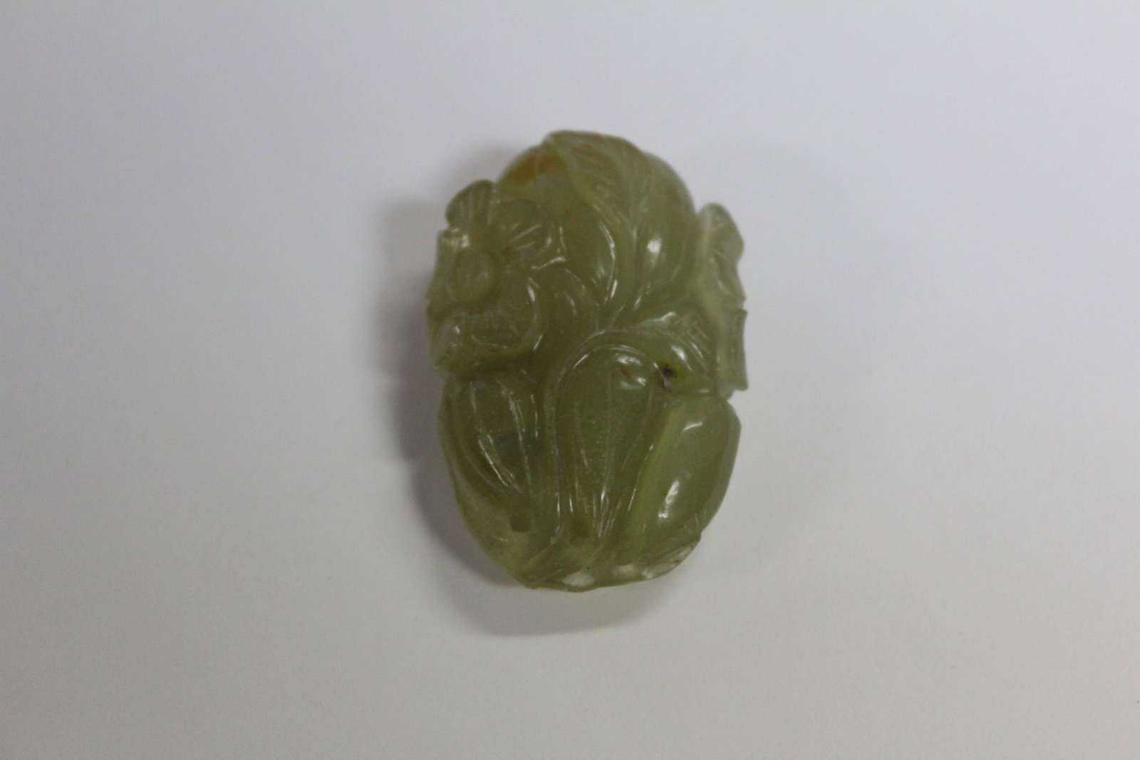 Carved Jade Pendant in Fruit and Flower Form: 1 1/2" long.
