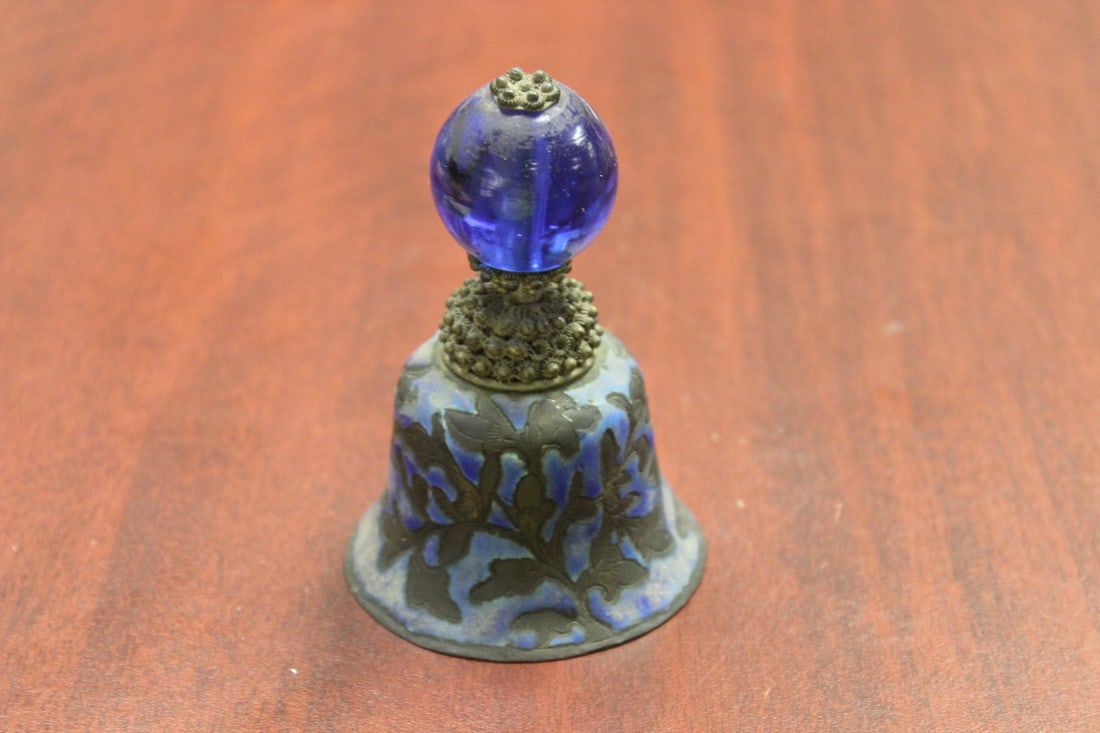 A Peking Glass Bell: 19th century Chinese bell withMadarie hat peking glass finial - marked China - 4inches tall