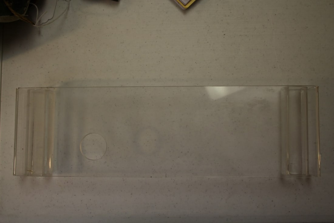 A Lucite Stand: 17 1/8" long x 2" tall x 5" wide