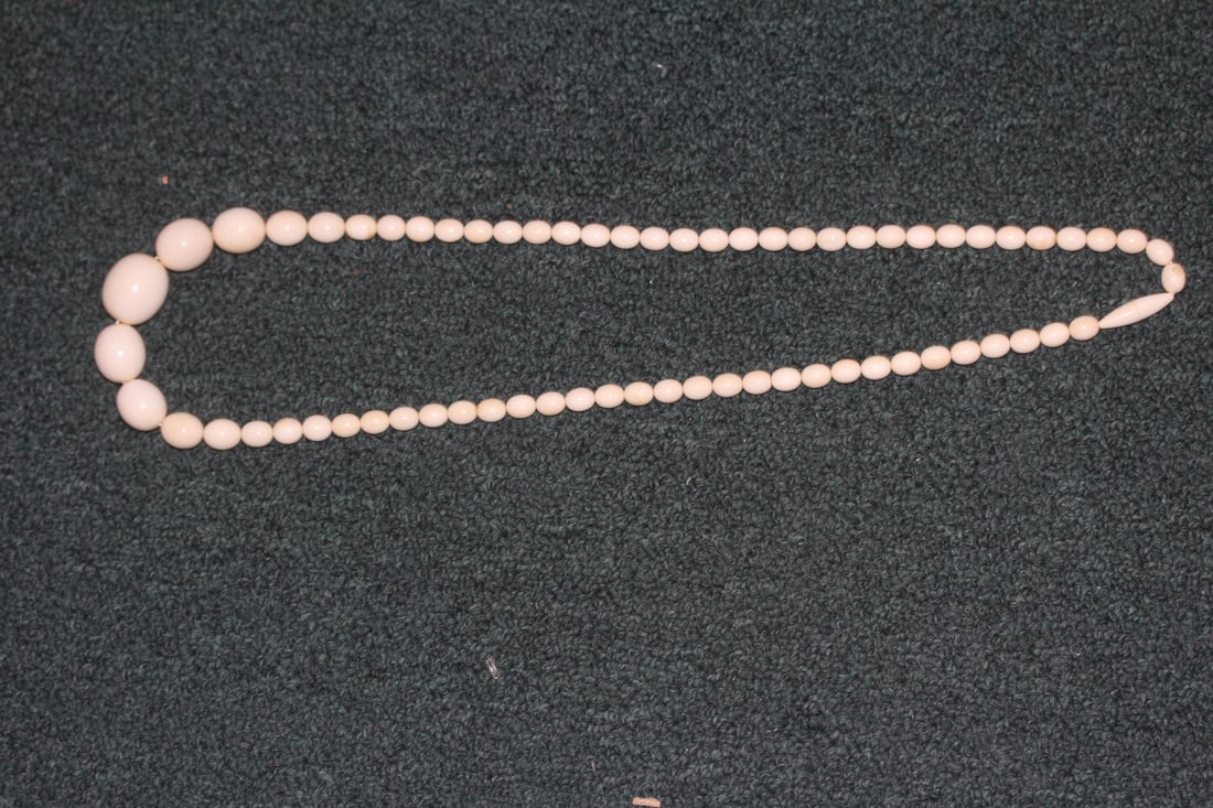 Carved Bone Necklace: 15 1/2" long when clapsed