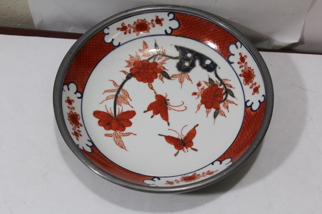 An Oriental Ceramic and Pewter Bowl: 8 inches in diameter