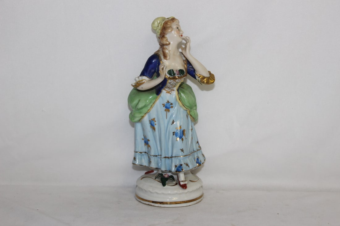 A Vintage Ceramic Figurine: 7 1/2" tall