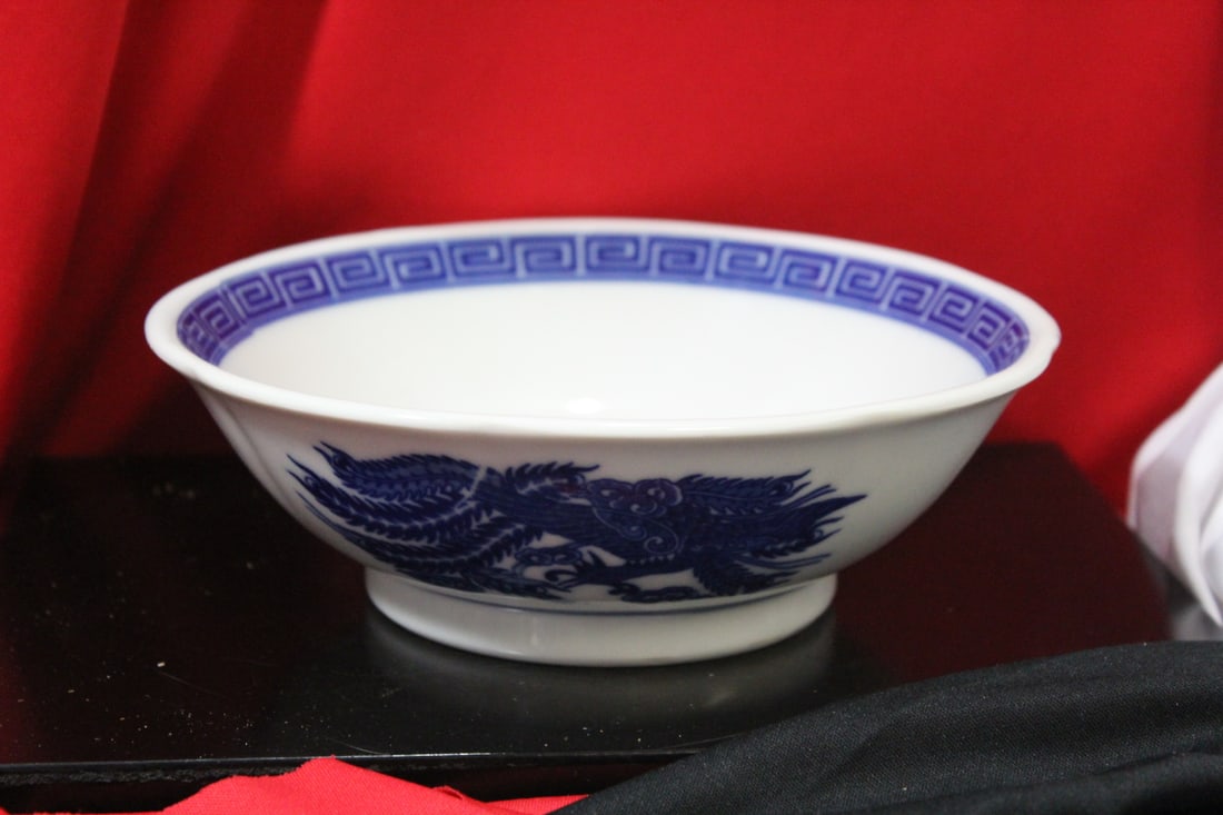 A Chinese Blue and White Dragon and Phoenix Bowl: 7 1/2" in diameter - signed