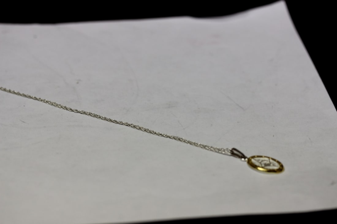 A Sterling Pendant With Chain: Marked 925