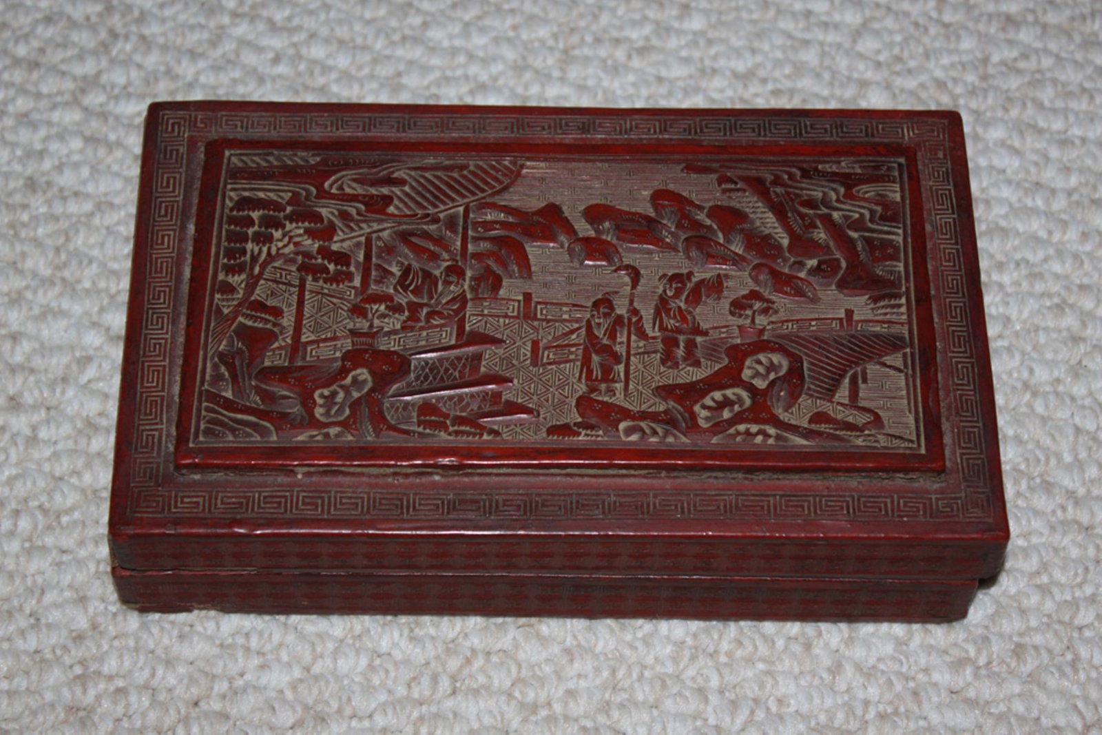 Antique Chinese Large Cinnabar Box: Circa 19th century. 10" x 5 3/4" x 2 1/2". Nicely carved and detailed.