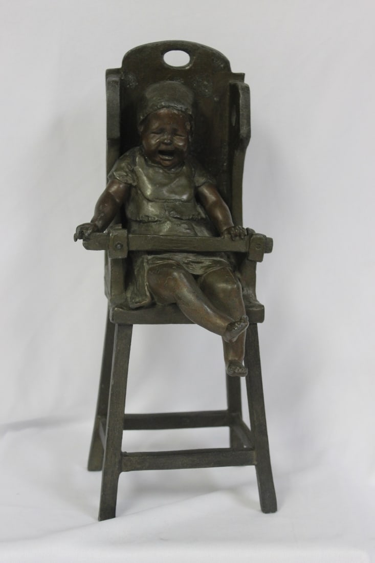 A Bronze Child on a High Chair by Steiner: signed - 13" tall