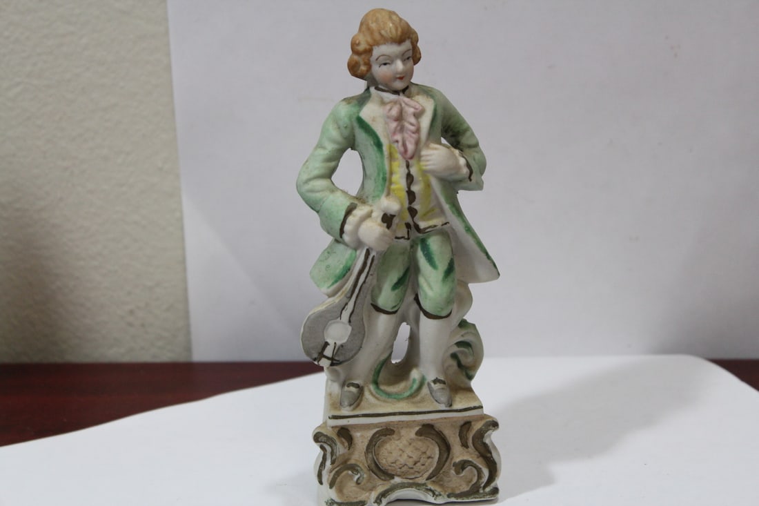 A Japanese Ceramic Figurine: 7" tall
