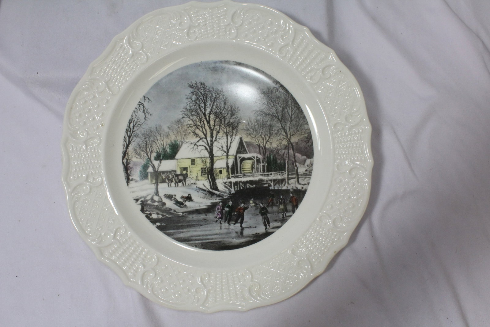 A Currie and Ives Ceramic Plate: 10 1/4" in diameter