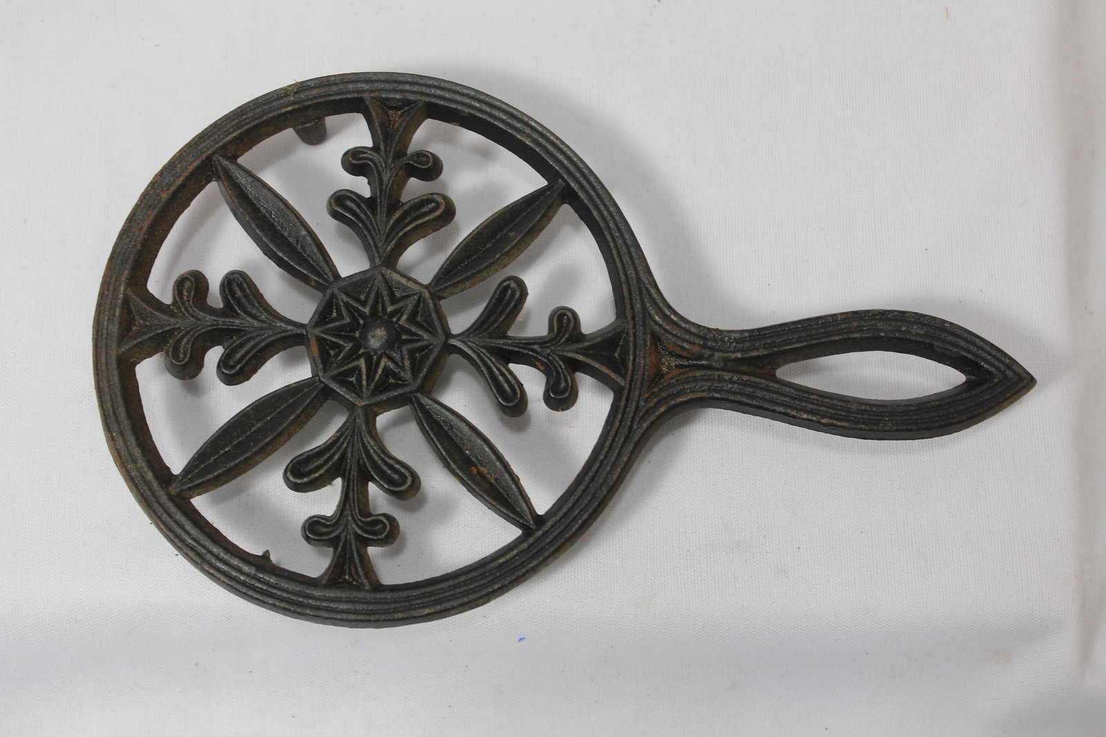 A Cast Iron Trivet: 7 3/4" long