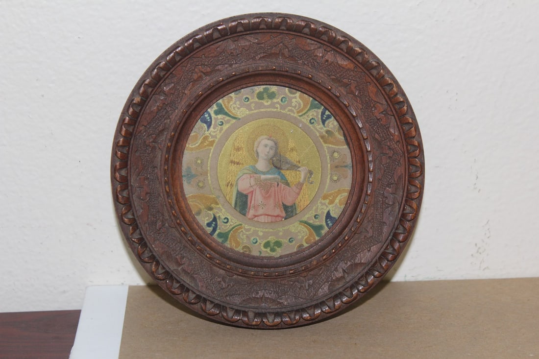 An Antique Nicely Carved Religious Framed Print: inside diameter= 2 3/4" - overall= 5 1/2" in diameter