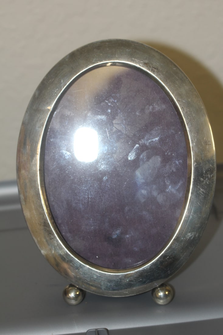 Sterling Silver Photoframe: marked "sterling" - overall= 6 5/8" z 5"