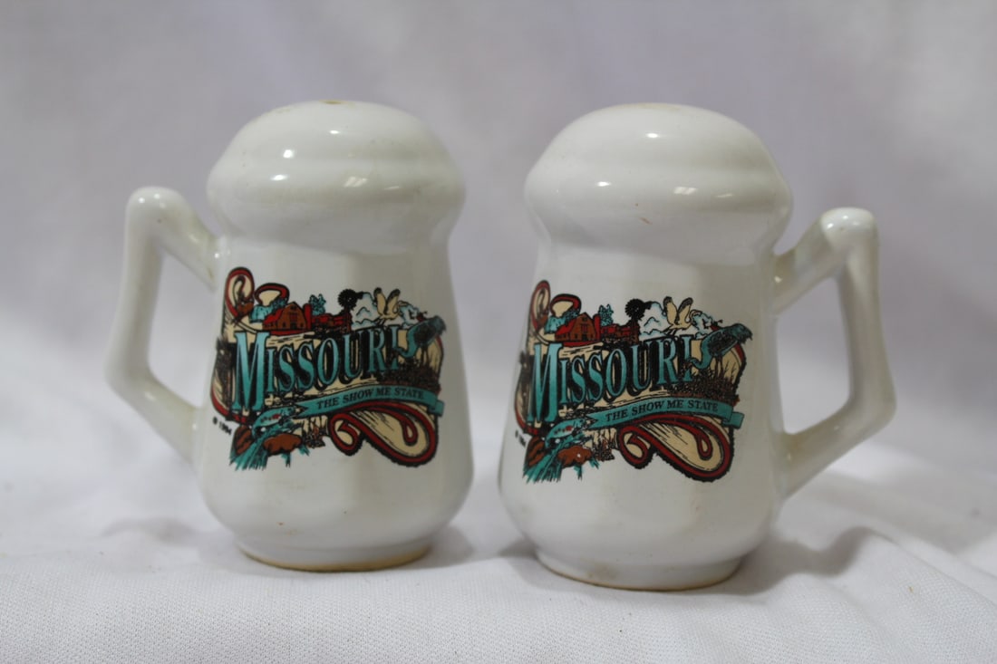 A Pair of Salt and Pepper Shakers: 3 1/4" tall