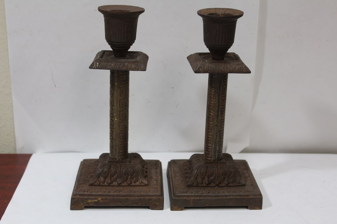 A Pair of Vintage Candlesticks: most likely iron - 7 1/2" tall - has a number on the bottom